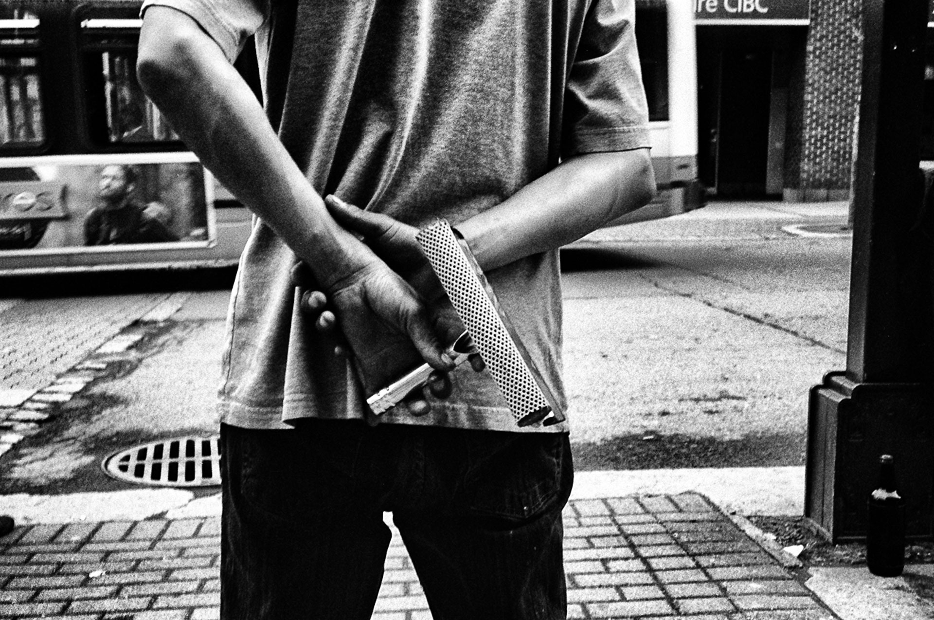 black and white photo - man with window squeegee